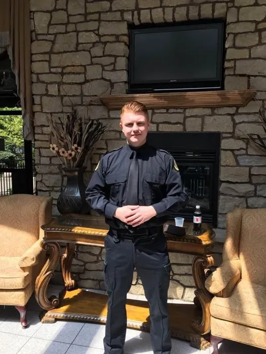 Mitch in his correctional officer uniform